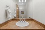 Large mirror and bathtub in master bath